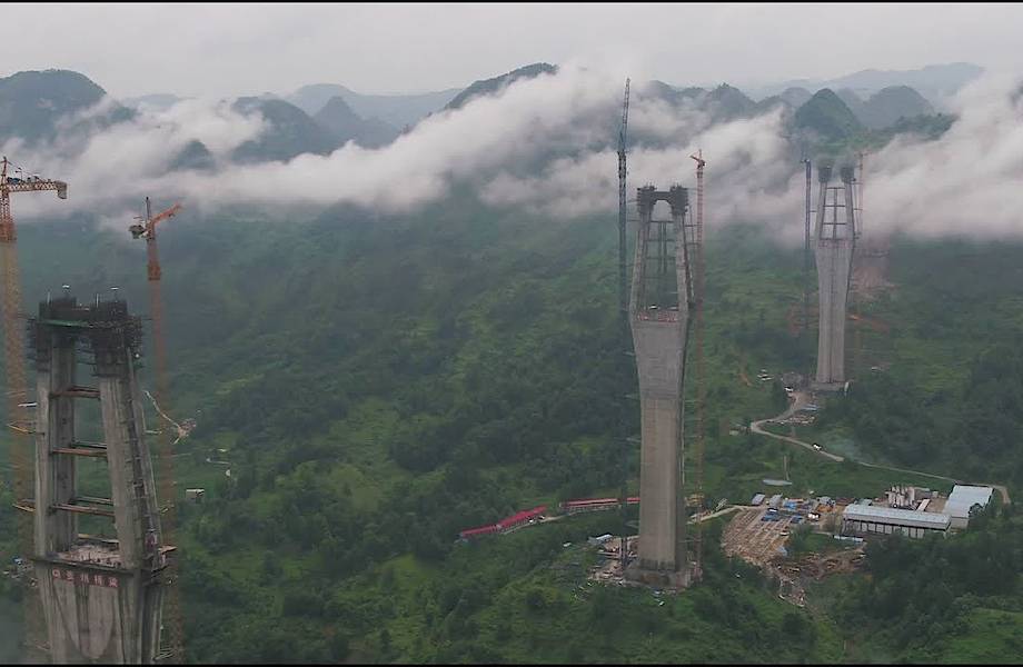 Видео: Как строят гигантский мост-небоскреб в Китае